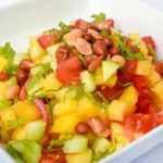 Mixture of tomatoes, cucumbers, mango, pineapple, mint leaves, spices and topped with Spanish peanuts.