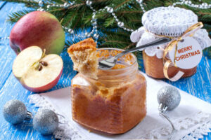Spiced apple cake baked in clear glass jar.