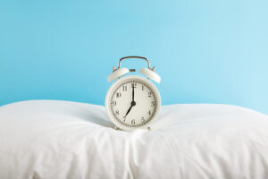 alarm clock on pillow