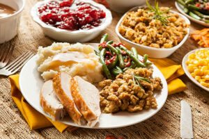 Traditional Homemade Turkey Thanksgiving Dinner with Mashed Potatoes, Stuffing, and Corn